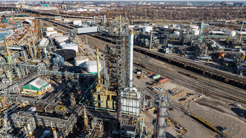 Oil refinery industrial complex producing fossil fuel energy