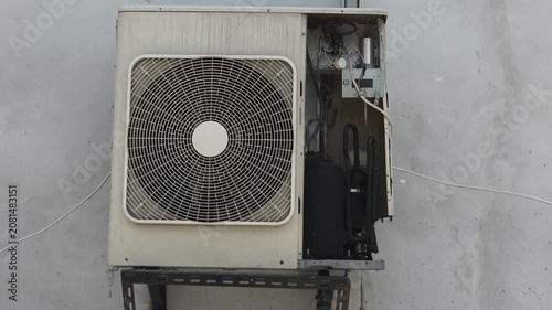 Exterior Air Conditioning Condenser Unit with Exposed Internal Components