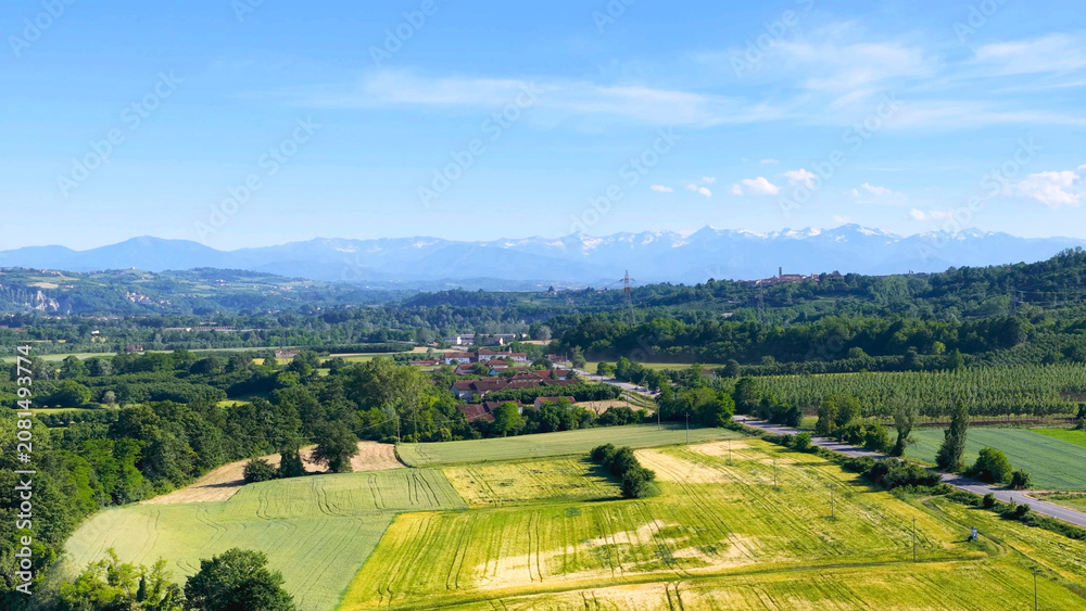 Fototapeta premium Aerial View of Piedmont Farmland and Distant Alps Mountains in Italy