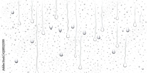 Fotografie Rain droplets flowing down transparent glass pane background with droplets trans