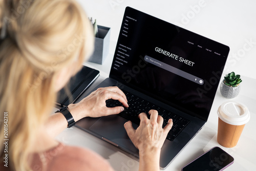 Fotografie Woman using generative ai tool generating sheet on laptop