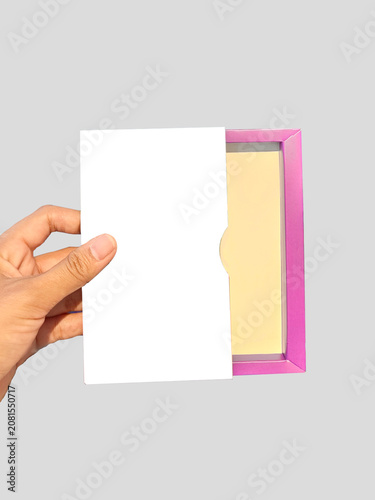 Tableau sur toile Isolated hand holding empty white card on pink box frame for logo branding design