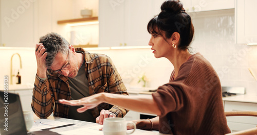 Φωτογραφία Couple, man and stress with finance paperwork in home for debt review, overdue bills and inflation