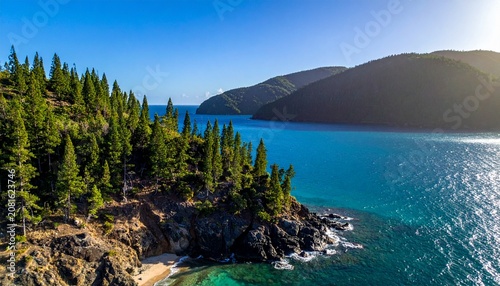Serene mountain lake surrounded by dense evergreen forest.