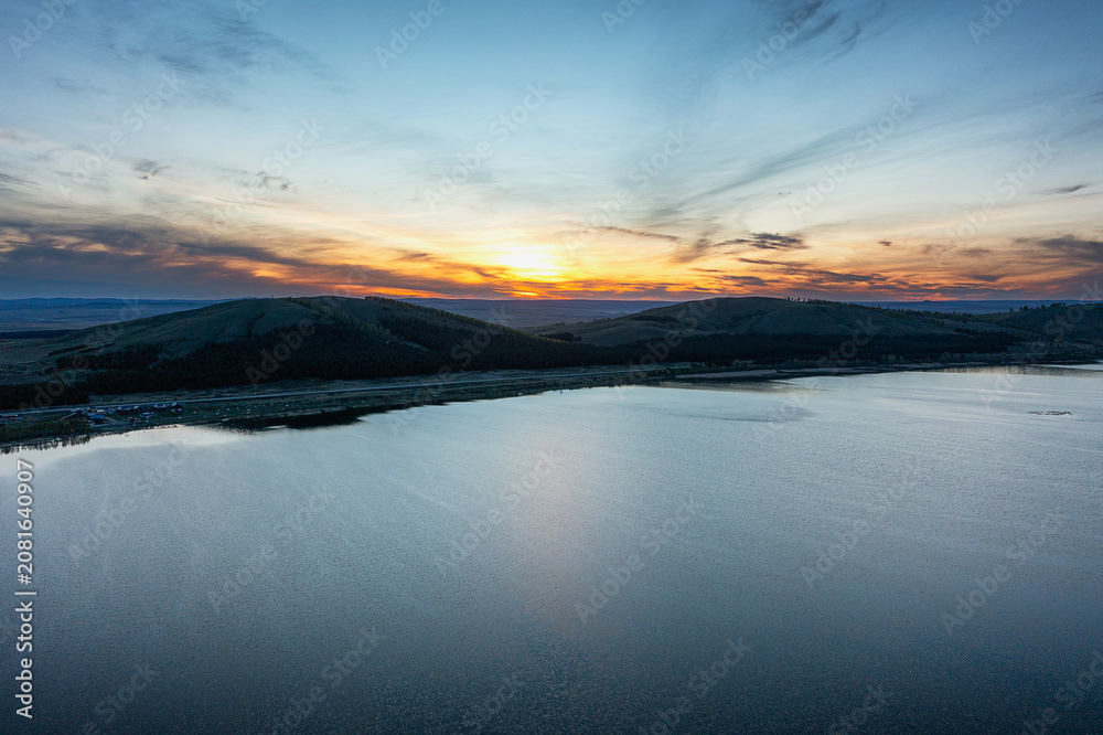 Fototapeta premium Southern Urals in spring: Irendyk ridge and Talkas Lake at sunset.