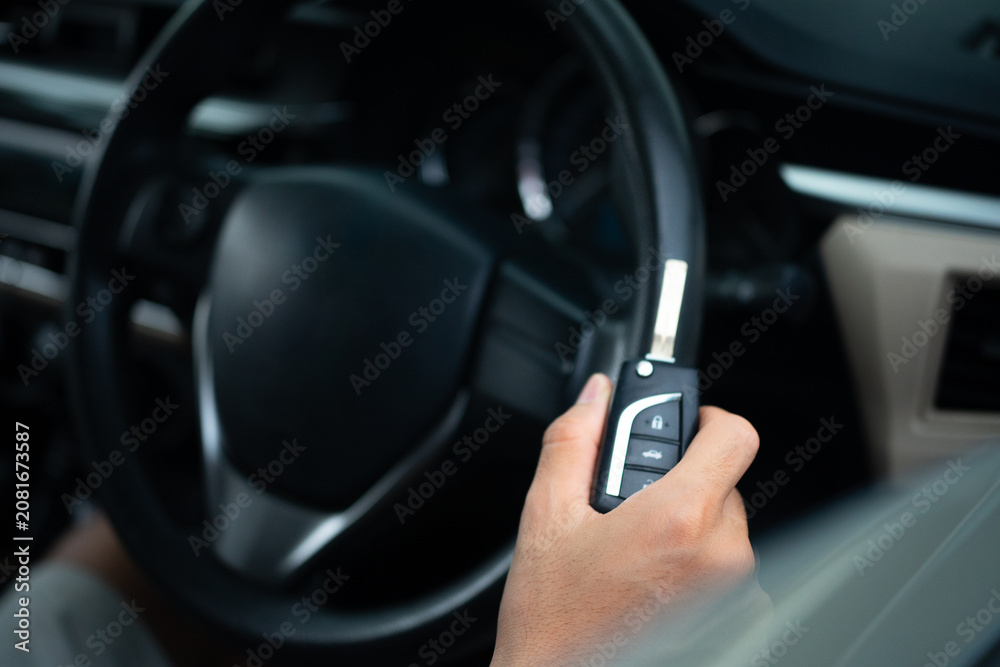 Obraz premium Close Up of Man Holding car key ready to drive.