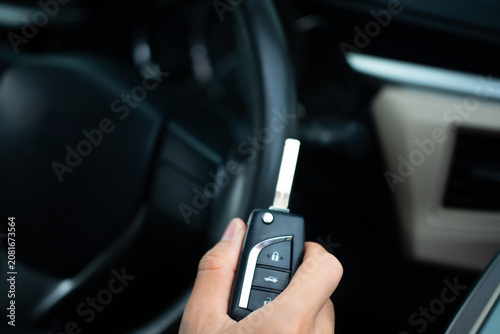 Close Up of Man Holding car key ready to drive.