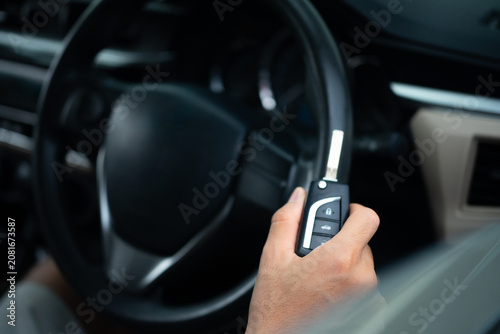 Close Up of Man Holding car key ready to drive.