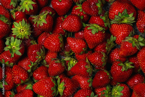 Top view of fresh red strawberries as food background