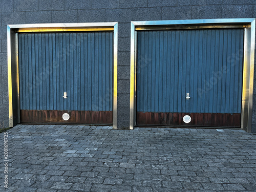 Two Closed Sectional Garage Gates in Modern Building Outdoor.