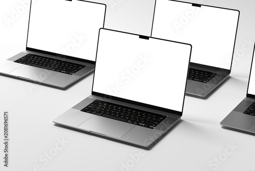 Realistic composition of three modern laptops with blank white screens arranged on a clean studio background. Perfect for responsive website previews, application mockups, technology branding, busines