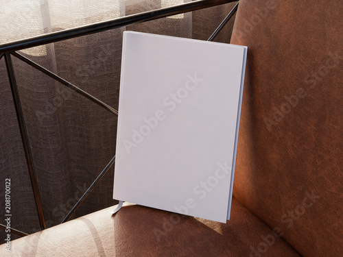 Fotografie Blank white brochure mockup standing on leather chair armrest