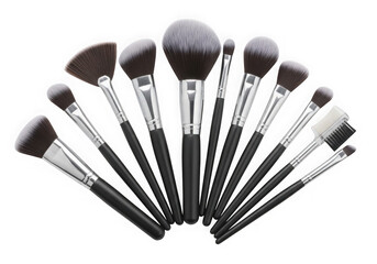 Assorted makeup brushes set on white surface isolated on transparent background