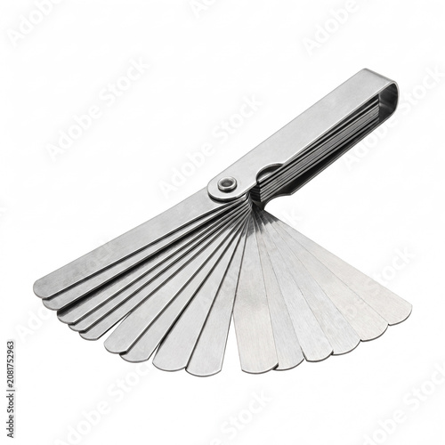 Photos Generic mechanical feeler gauge measuring tool isolated on white.