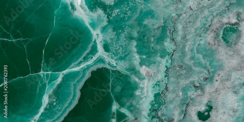 Elegant emerald green onyx marble texture with translucent layers and natural stone veins.