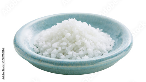 Tableau sur toile Coarse sea salt crystals piled high in a light blue ceramic dish, isolated on tr