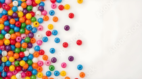 A bright and colorful plastic craft beads is scattered around a plain colored background. Ideal for threading into jewelry, keychains, and creative DIY projects.