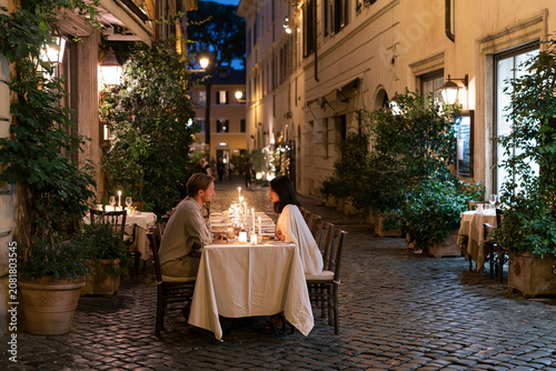 couple dining at outdoor italian restaurant
