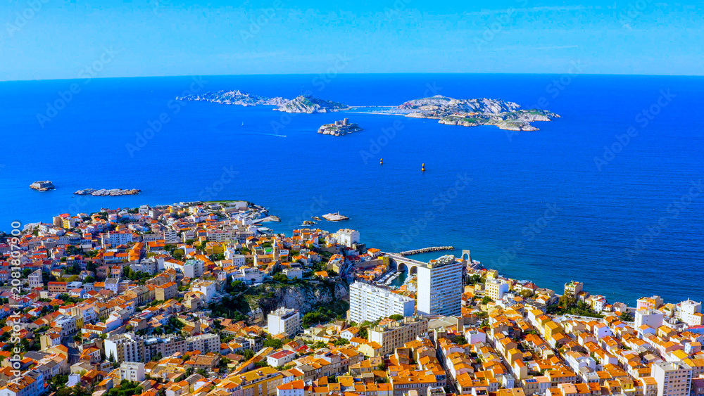 Naklejka premium Aerial view of Marseille coastline with residential districts, Chateau d'If and Frioul Islands in the Mediterranean Sea, France