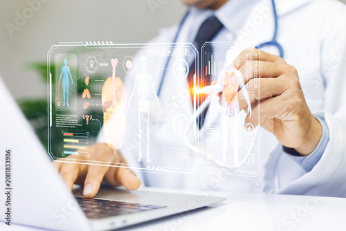 Doctor using digital medical interface with human body hologram and health data analysis. Concept of longevity, preventive healthcare, medical technology, health monitoring, diagnostics medicine.