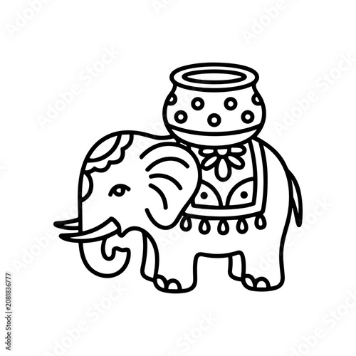 Elephant with decorative saddle on back.