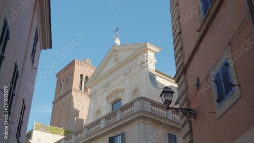 Historic Church Facade Framed by Narrow Street in Rome, Italy
