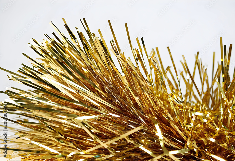 Fototapeta premium gold tinsel decoration on white background