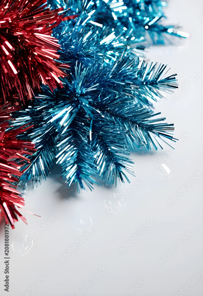 Fototapeta premium Red and blue tinsel on white background