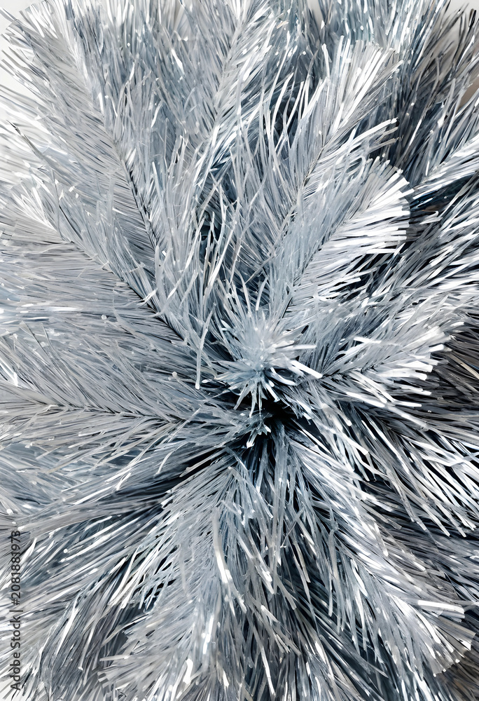 Fototapeta premium Silver Christmas tinsel close-up on white background