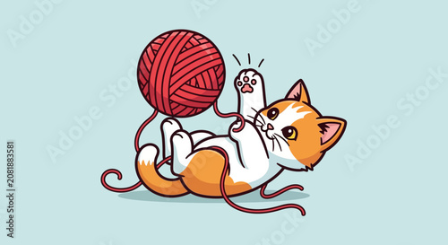 Playful Kitten with Ball of Yarn on Light Blue Background