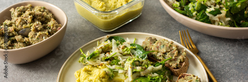Slika na platnu Boiled potatoes are served with hummus alongside a gluten free sandwich filled w