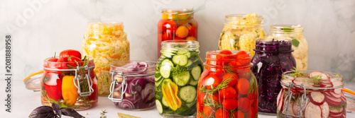 Fotografie Fresh vegetables like cabbage, tomatoes, cucumbers and radishes, onions, corn, p