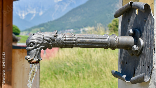 Billede på lærred Decorative Public Drinking Water (Trinkwasser) Spout in Rural Alpine Austria