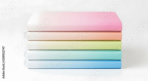 Stacked five notebooks featuring whisk gradient glow layered covers in pastel rainbow colors on a white studio background