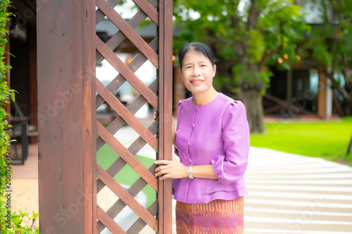 Portrait Photo of Northeastern Thai women with traditional costumes.Thai silk dress concept