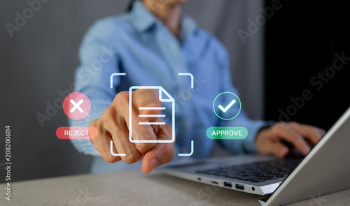 Fotografía Business woman touching virtual document icon for approve or reject decision concept with laptop