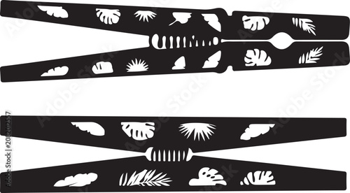 Obraz na płótnie Set of decorative wooden clothespins with tropical leaf patterns