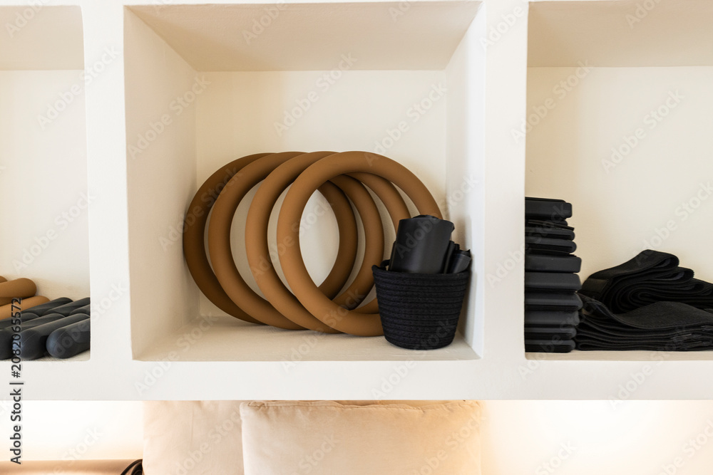 Obraz premium Pilates rings and workout equipment organized in cubbies