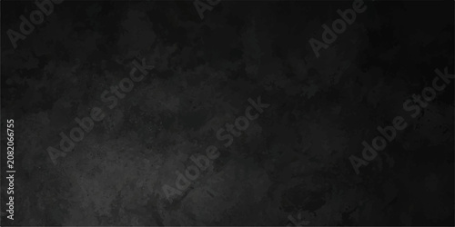 Abstract dark charcoal concrete texture background with a weathered matte surface for modern design and abstract photography projects.
