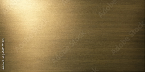 Foto A close-up shot captures the textured surface of brushed gold metal, highlighted by a soft, diffused light source casting subtle shadows and creating a sense of warmth and luxury