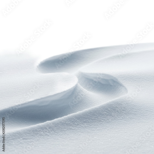 Close-up photorealistic pristine undulating snowdrifts with soft curves and cool blue shadows, isolated on a high-key white background, conveying a minimalist serene atmosphere