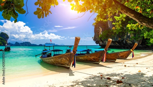 A serene beach scene with wooden boats on shore
