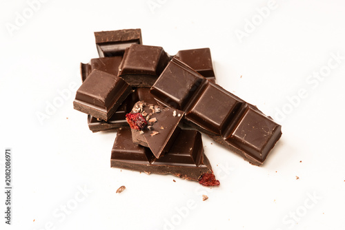 A chocolate bar with dried berries isolated on a white background.