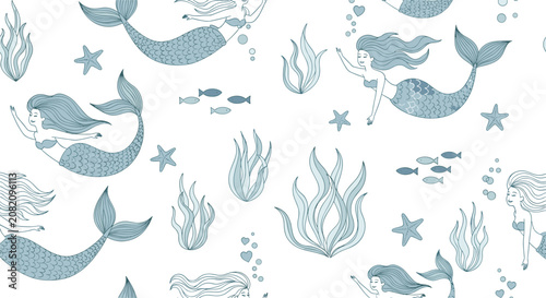 Seamless underwater pattern featuring hand drawn blue mermaids swimming among seaweed starfish and schools of fish on a white backdrop.