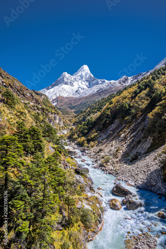 Dudh koshi valley against Mt. Ama Dablam in autumn sunny day. Everest base camp trekking, Himalaya mountains in Khumbu, Nepal.