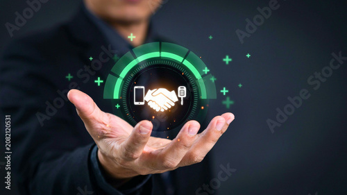 Businessman holding glowing digital handshake icon for smart contract security