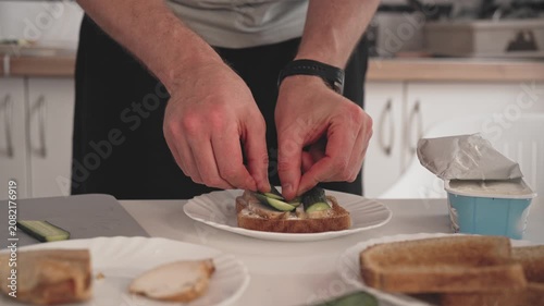 A person is making a dish in a kitchen. They cut fresh vegetables and arrange them on a plate. The kitchen has basic tools and cooking supplies.