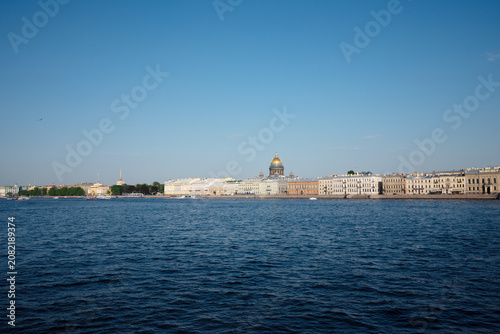 View  on the Neva river  to the embankment of Saint Petersburg, houses and St. Isaac's Cathedral