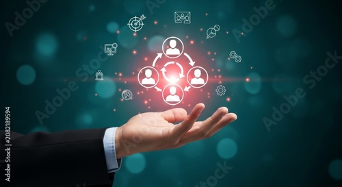 Business professional holding digital network diagram with interconnected icons representing teamwork communication and collaboration in a futuristic