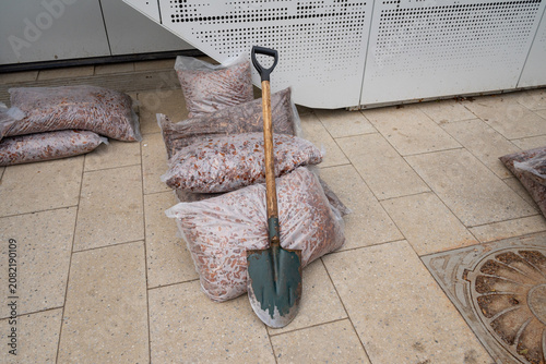 Shovel on plastic bags with fertilizer